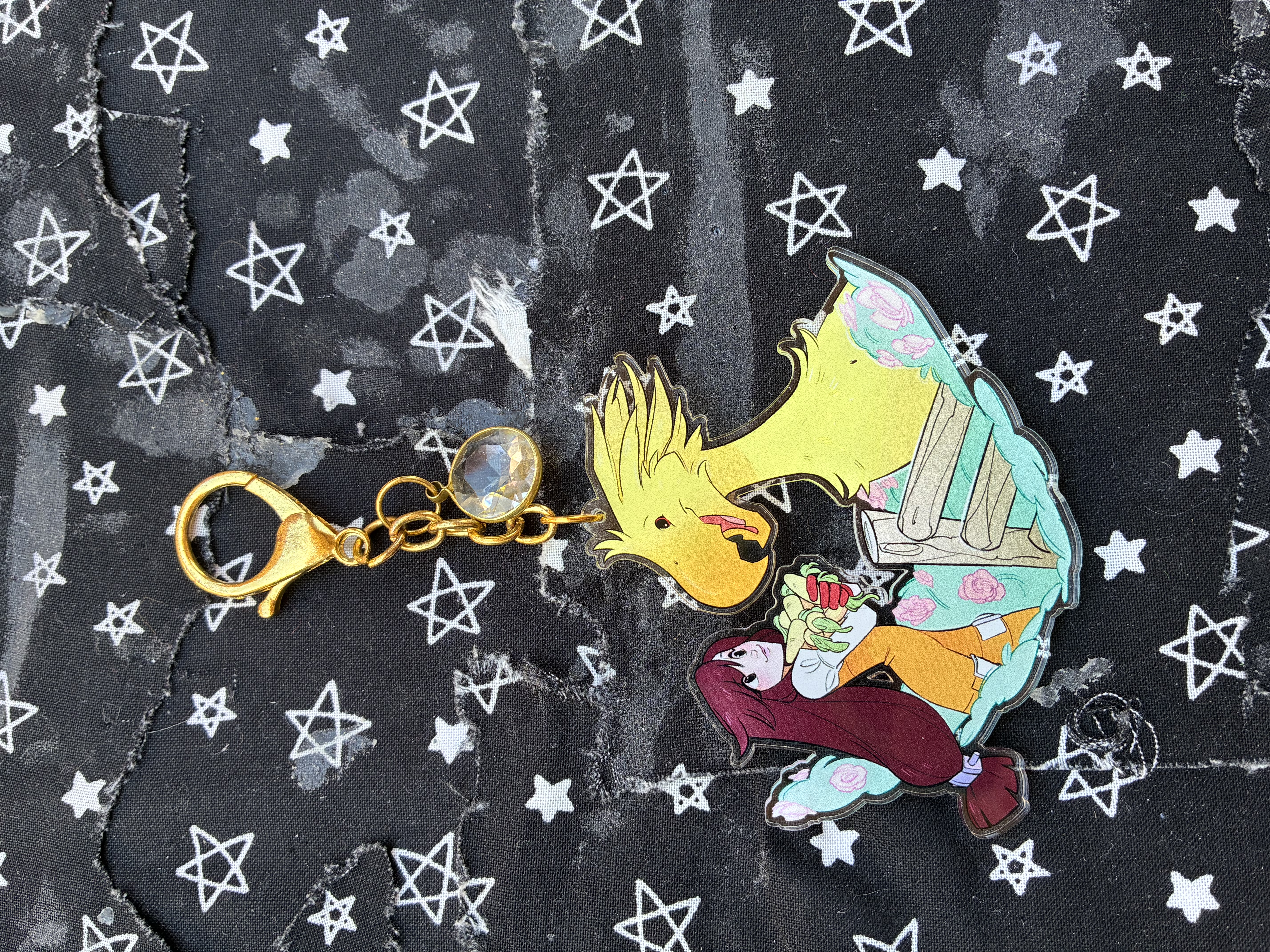 Acrylic charm of Final fantasy 9 Garnet feeding a chocobo.